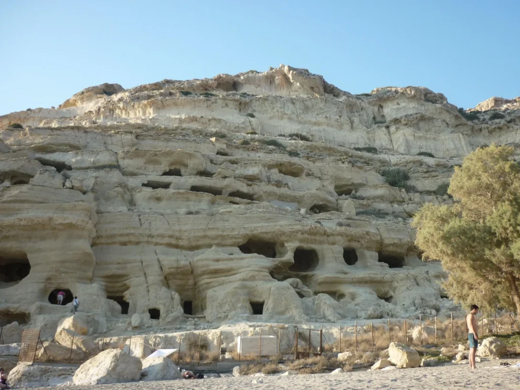 close up photo of a rocky cliff above a beach