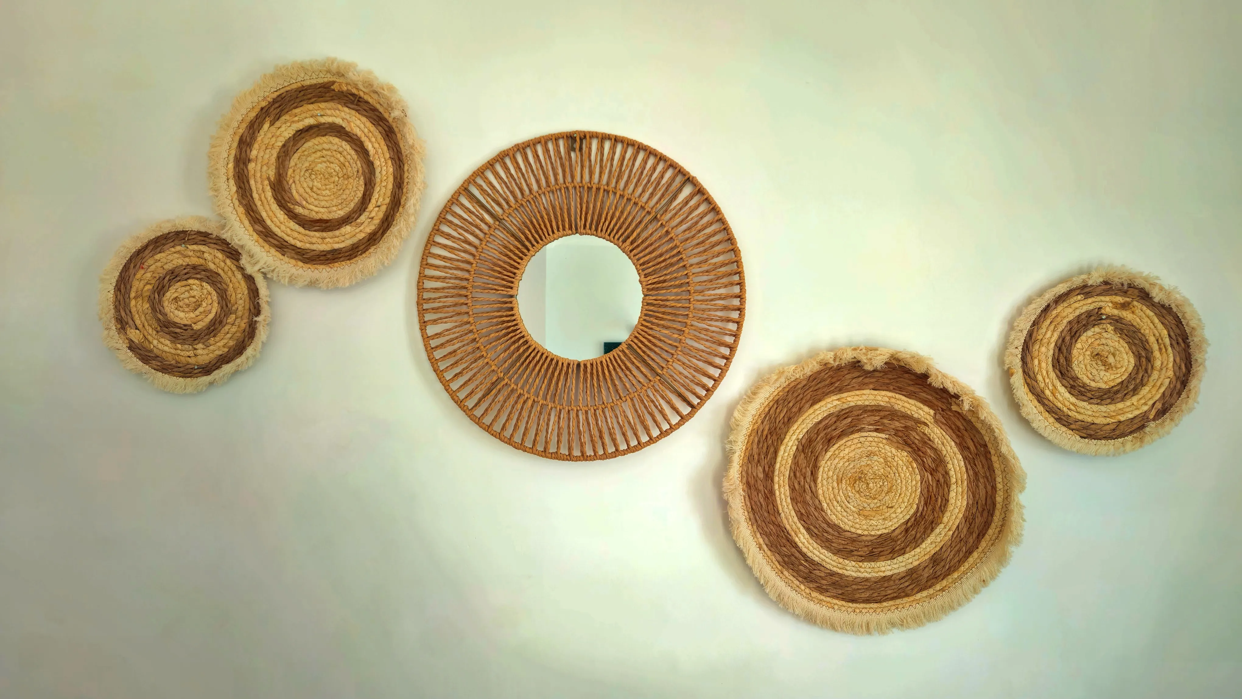 realistic photo of various circular decorations in a random pattern on a wall