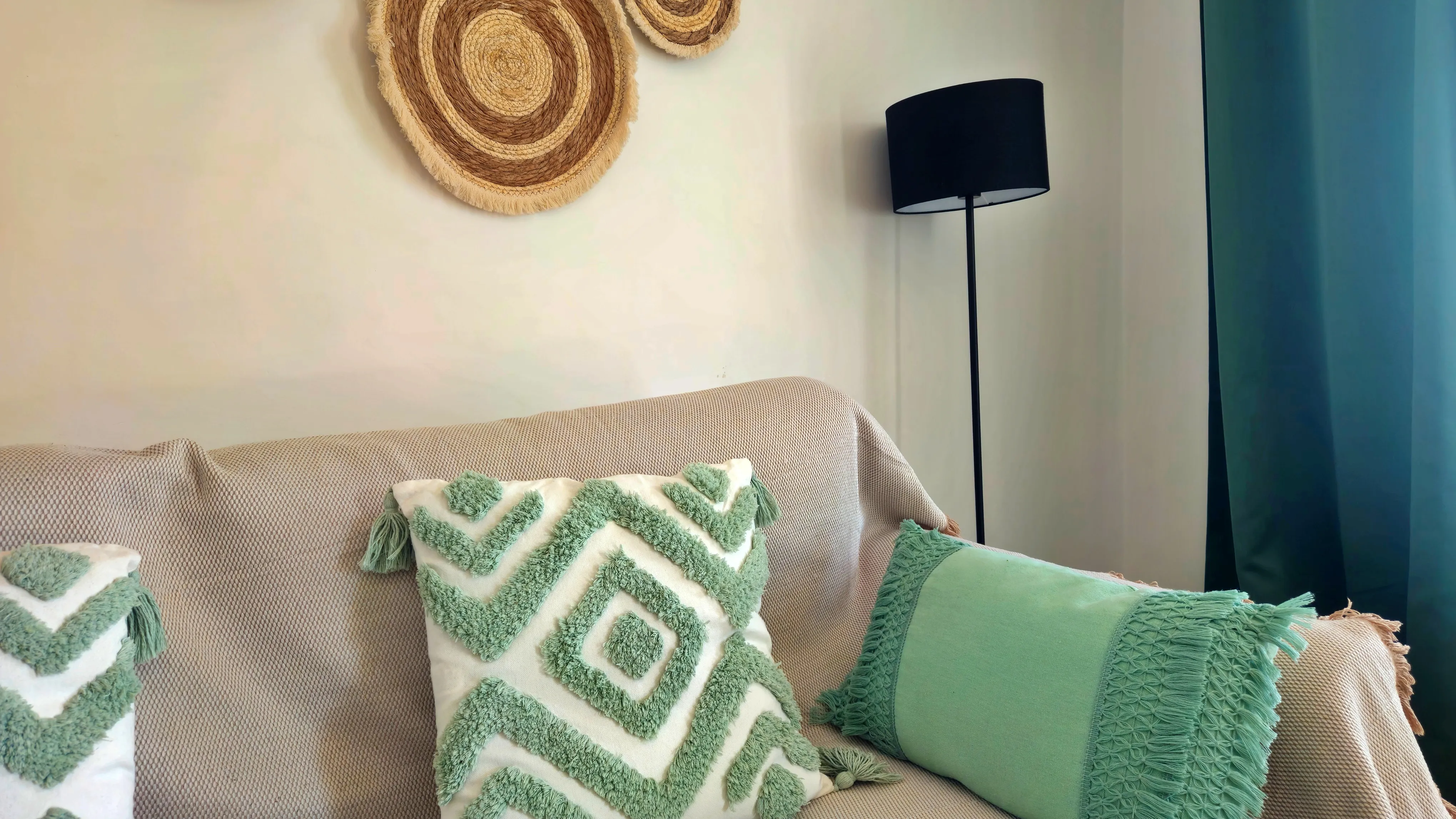 close up view of a sofa with colorful pillows