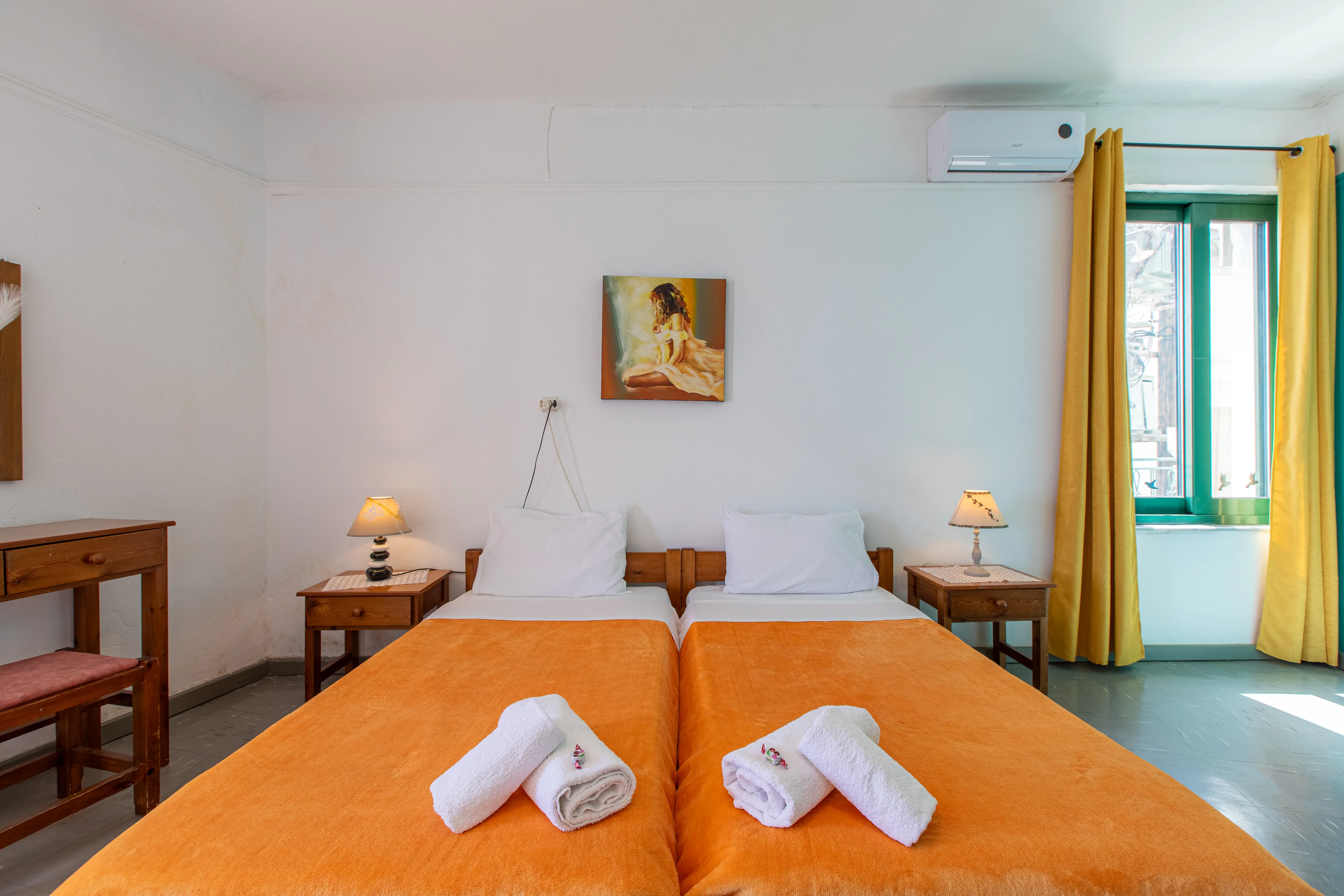 inside view of a room featuring two single beds from the front